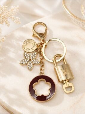 Authentic Louis Vuitton Gold Lock & Key with unbranded Clover Flower Bagcharm